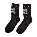 Imagen del producto Harry Potter - Calcetines con tachuelas y logo de Hogwarts negro