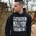 Imagen del producto Sudadera con capucha negra 'Lo que no te mata te da XP'