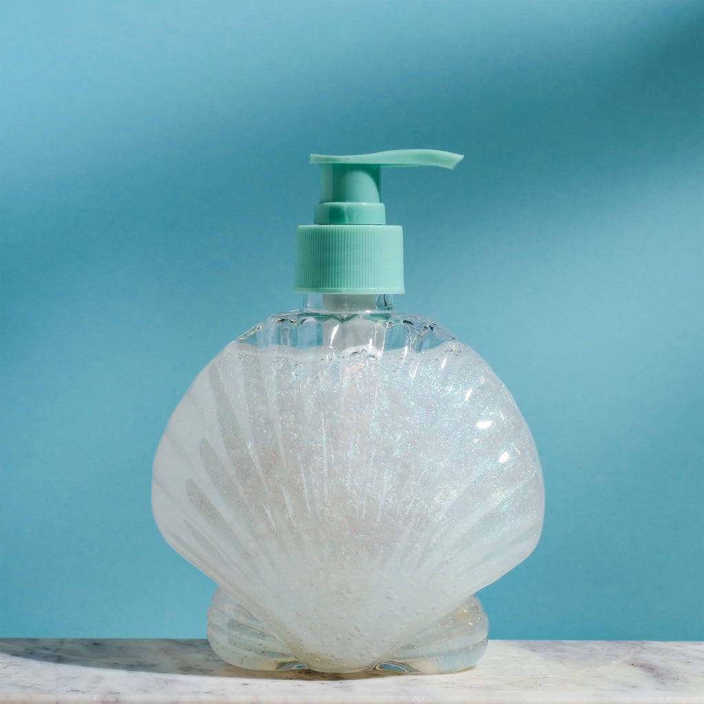 Imagen del producto Ariel - Dispensador de jabón en concha con gel de ducha