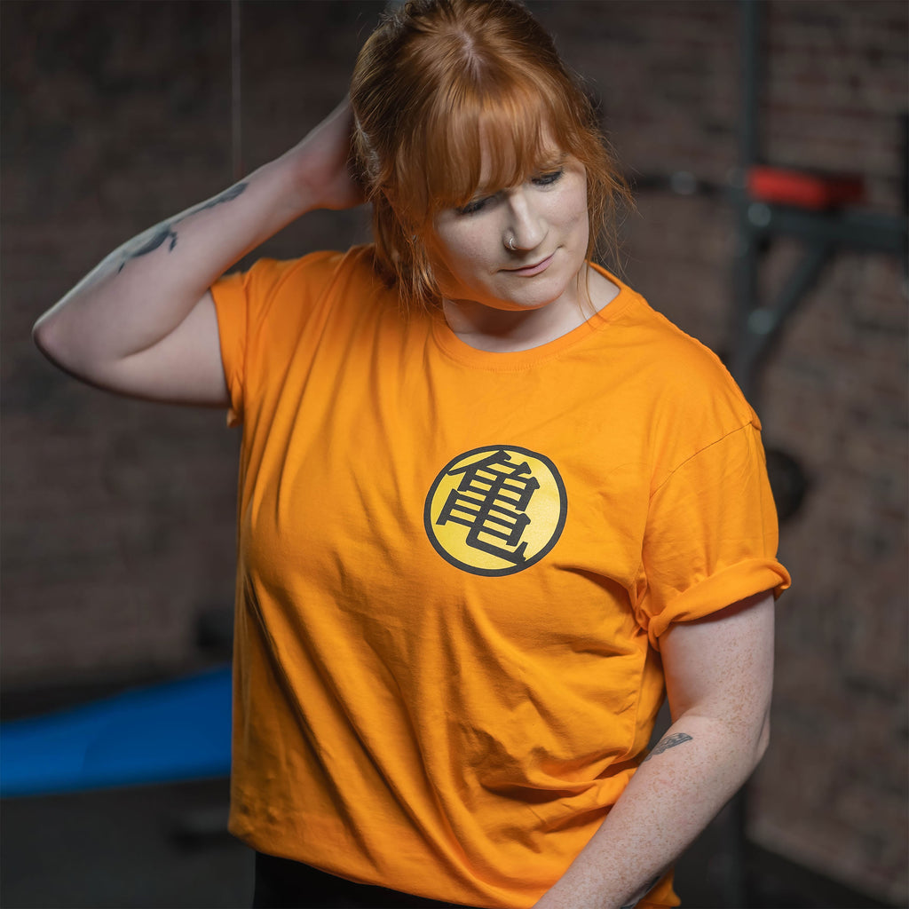 Imagen del producto Dragon Ball - Camiseta naranja con símbolo Kame