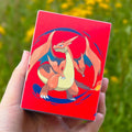 Imagen del producto Pokémon - Ultra Pro: Caja Alcove Flip Mega Charizard Y para 100 cartas coleccionables